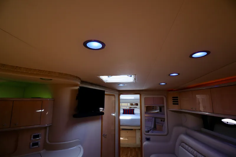 Slide: The Image of Interior of 1999 Sea Ray Sundancer 460 yacht with modern lighting. - 28