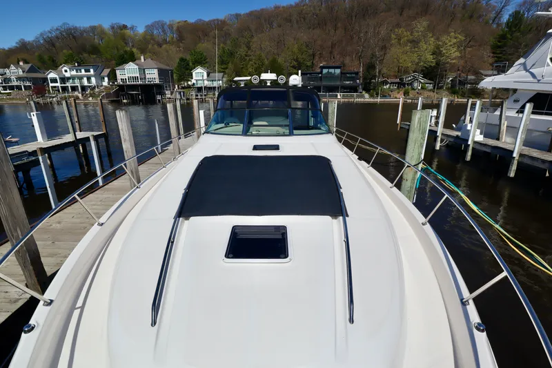 Slide: The Image of 1999 Sea Ray Sundancer 460 docked with scenic background. - 3