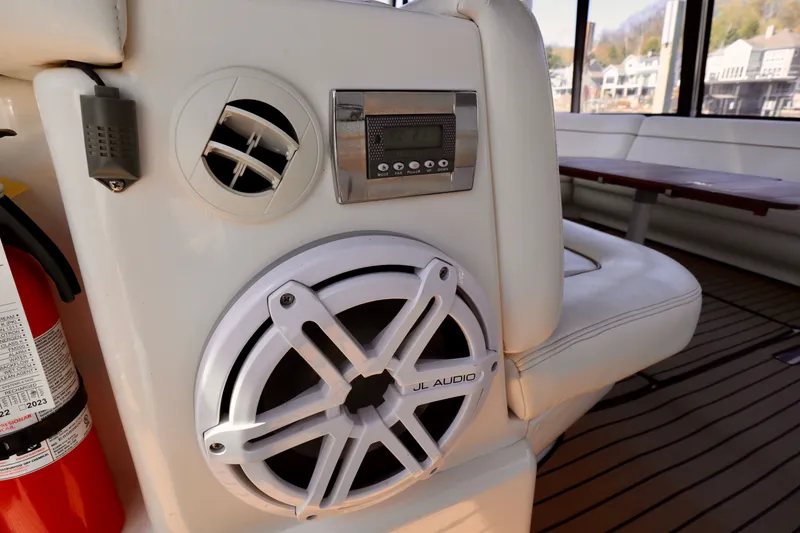 Slide: The Image of Interior of a 1999 Sea Ray Sundancer 460 with speaker and controls. - 32