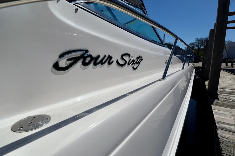 Slide: The Image of 1999 Sea Ray Sundancer 460 boat docked. - 48