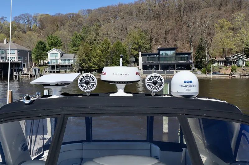 Slide: The Image of 1999 Sea Ray Sundancer 460 with modern navigation systems by the riverside. - 5