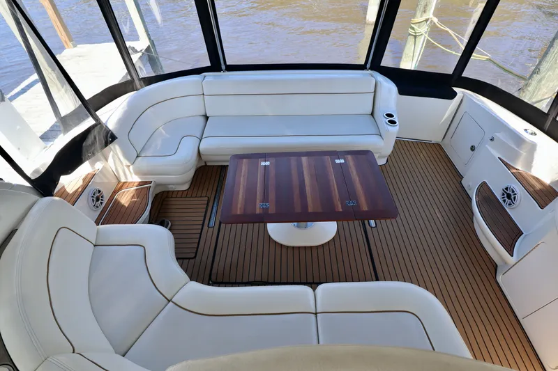 Slide: The Image of 1999 Sea Ray Sundancer 460 yacht interior with elegant seating area. - 8