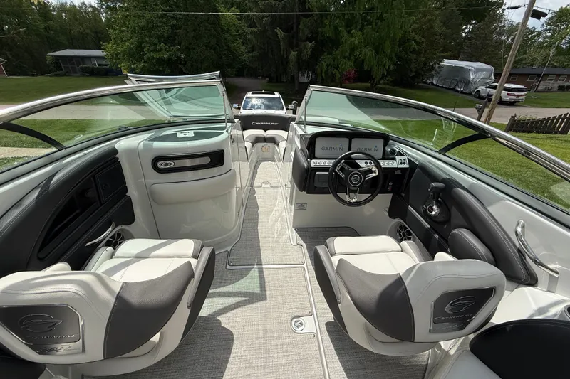 Slide: The Image of 2022 Crownline 280 SS boat interior with modern dashboard and seating. - 10