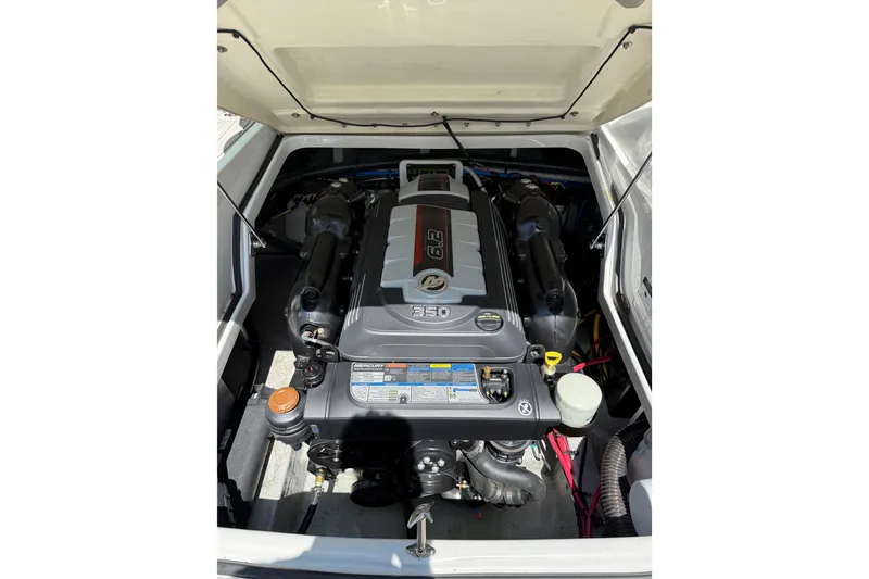 Slide: The Image of 2022 Crownline 280 SS engine compartment showcasing powerful marine engine components. - 15