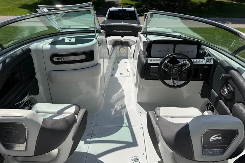 Slide: The Image of 2022 Crownline 280 SS boat interior with Garmin navigation system and sleek seating. - 18