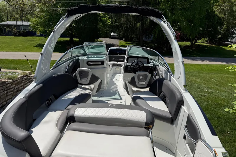 Slide: The Image of 2022 Crownline 280 SS boat interior with luxurious seating and modern dashboard. - 21