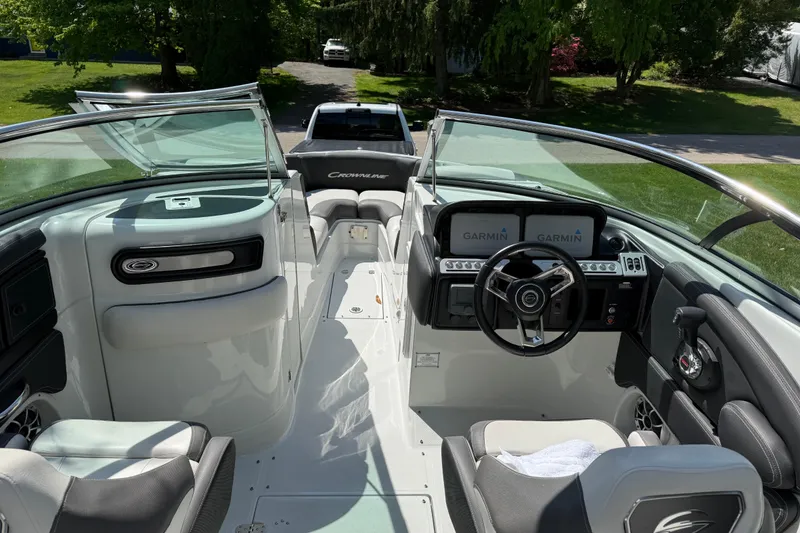 Slide: The Image of 2022 Crownline 280 SS boat interior with Garmin navigation, sleek design, and comfortable seating. - 22
