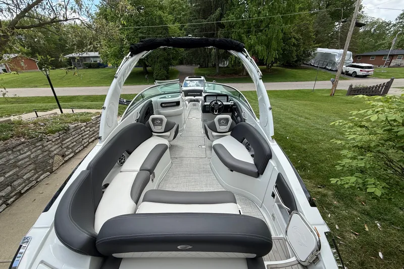 Slide: The Image of 2022 Crownline 280 SS boat interior with sleek seating and modern design. - 8