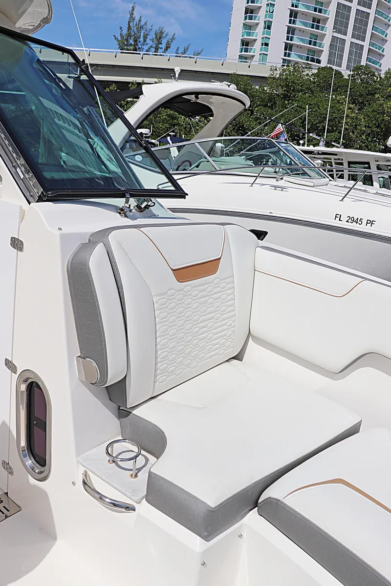 Slide: The Image of 2021 Tiara Sport 34 LX boat with luxurious seating and modern design. - 18