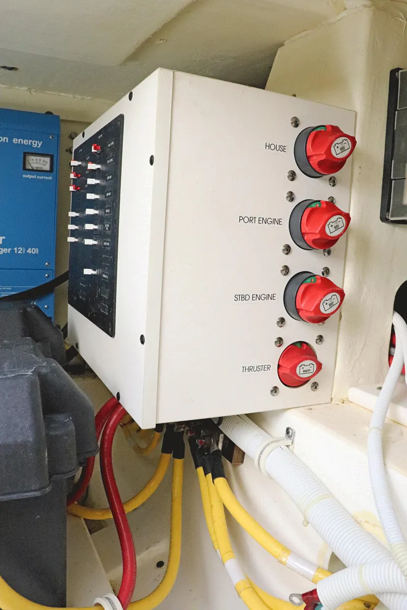 Slide: The Image of Electrical panel in a 2021 Tiara Sport 34 LX boat, featuring engine and thruster controls. - 27