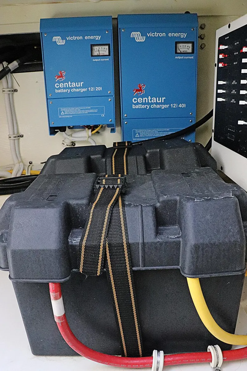 Slide: The Image of Battery setup with Victron Energy chargers in 2021 Tiara Sport 34 LX boat. - 28
