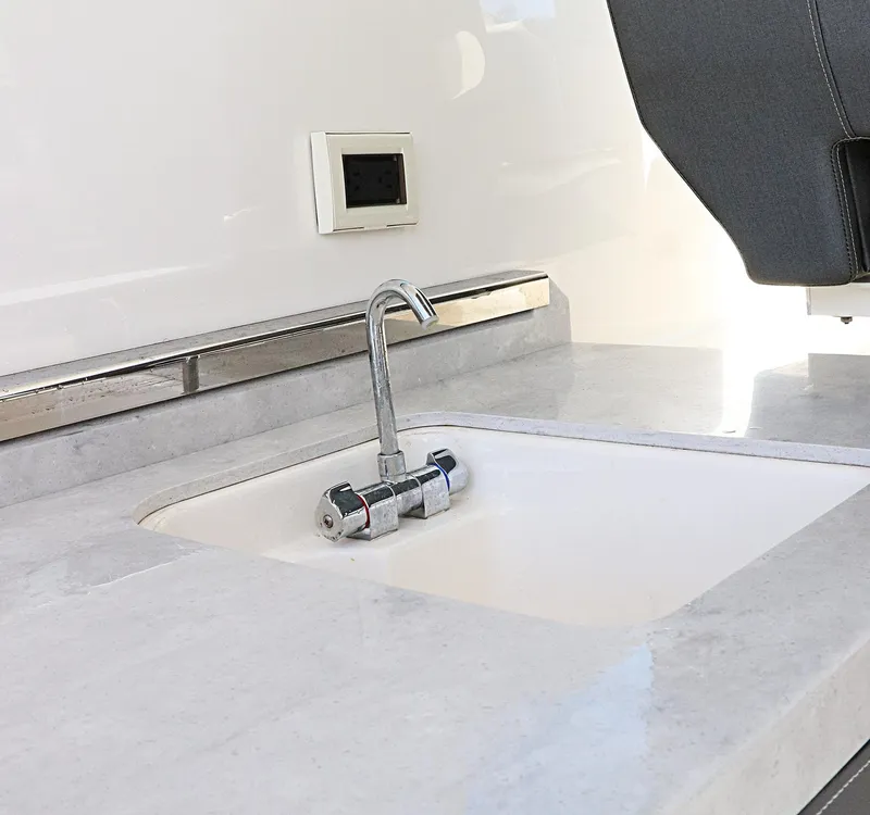 Slide: The Image of Tiara Sport 34 LX 2021 yacht sink with modern faucet and countertop. - 30