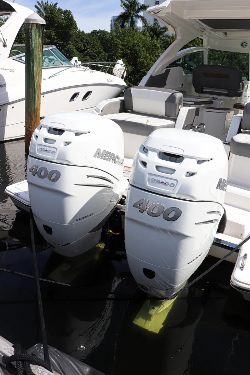 Slide: The Image of 2021 Tiara Sport 34 LX with twin Mercury 400 engines docked at marina. - 6