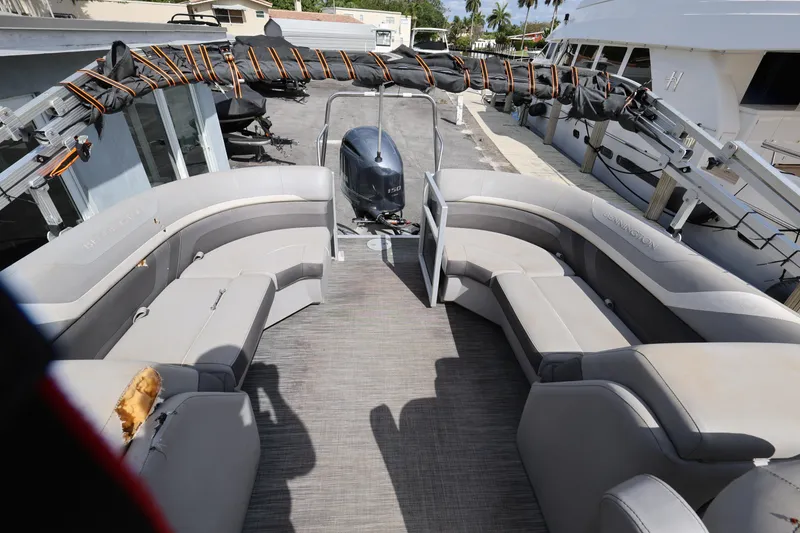 Slide: The Image of 2020 Bennington SX 22 SSRX pontoon boat with spacious seating and outboard motor. - 14