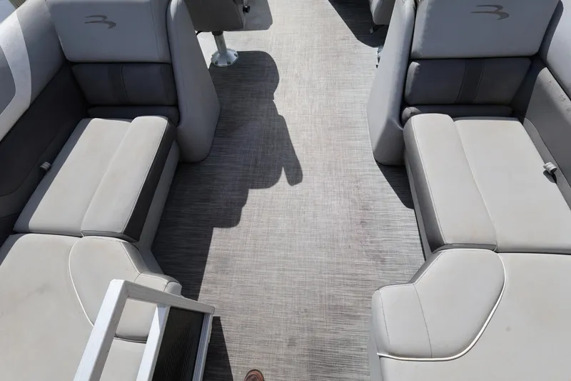 Slide: The Image of Interior seating of a 2020 Bennington SX 22 SSRX pontoon boat, featuring gray upholstery. - 16