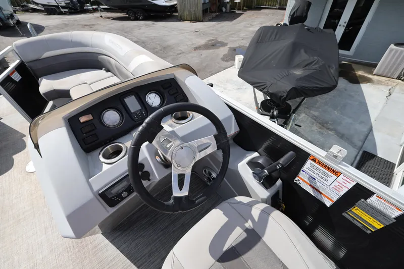 Slide: The Image of 2020 Bennington SX 22 SSRX boat interior with steering wheel and control panel. - 21