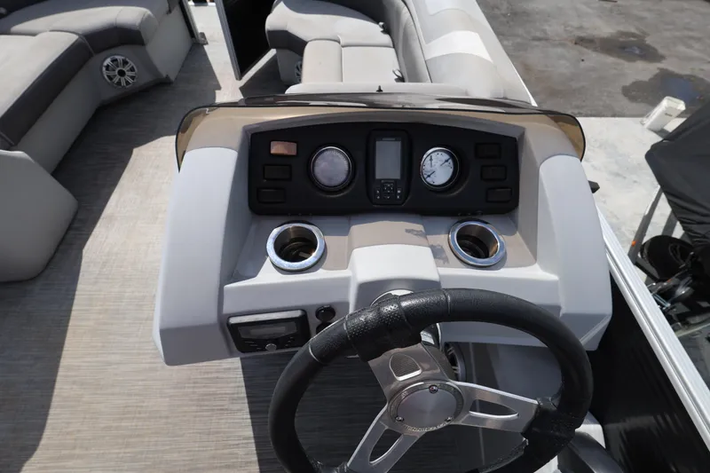 Slide: The Image of 2020 Bennington SX 22 SSRX boat dashboard with steering wheel and controls. - 22
