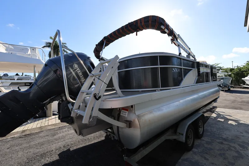 Slide: The Image of 2020 Bennington SX 22 SSRX pontoon boat on trailer with Yamaha outboard motor. - 8
