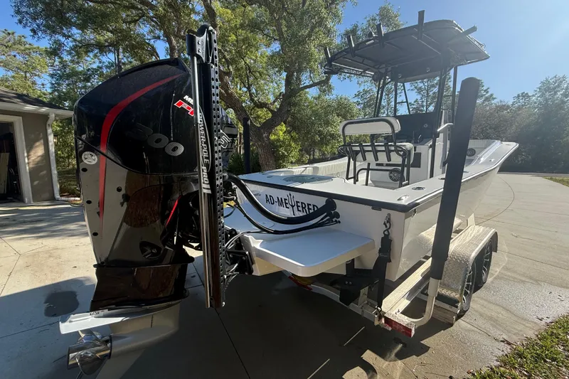 Slide: The Image of 1984 Chris-Craft 213 Scorpion boat with powerful Mercury engine on trailer. - 11