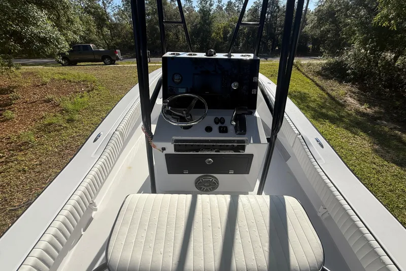 Slide: The Image of 1984 Chris-Craft 213 Scorpion boat interior with steering console and seating. - 20