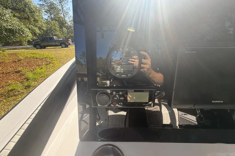 Slide: The Image of 1984 Chris-Craft 213 Scorpion dashboard with gauges and Garmin GPS under sunlight. - 22