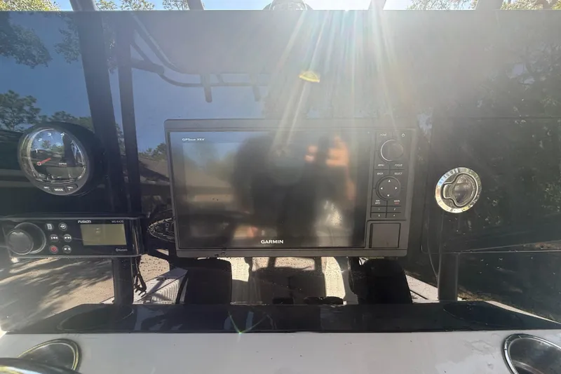 Slide: The Image of Dashboard of a 1984 Chris-Craft 213 Scorpion with Garmin GPS and Fusion audio system. - 23