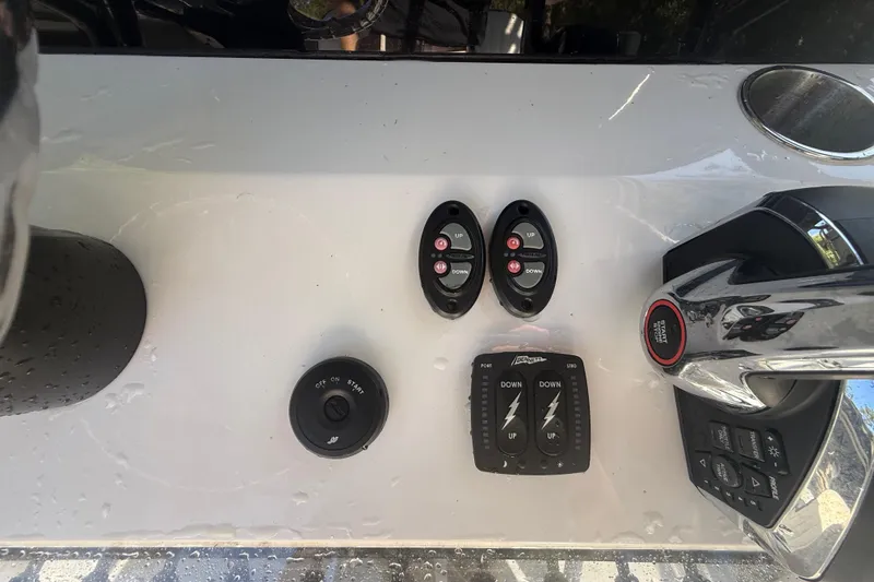 Slide: The Image of Control panel of a 1984 Chris-Craft 213 Scorpion boat with switches and throttle. - 26