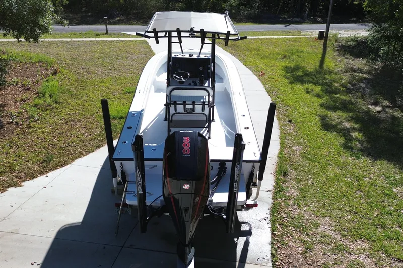 Slide: The Image of 1984 Chris-Craft 213 Scorpion boat with Mercury engine, parked on a driveway. - 3