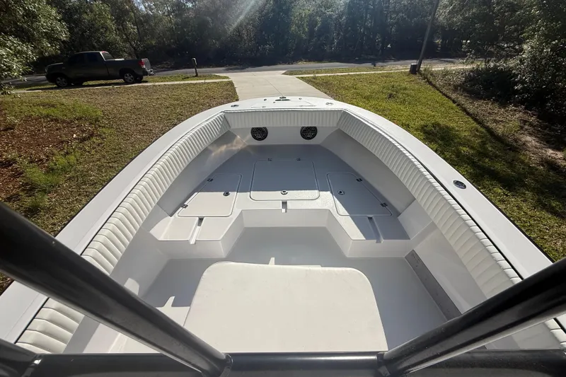 Slide: The Image of 1984 Chris-Craft 213 Scorpion boat interior, white seating, sunny outdoor setting. - 31