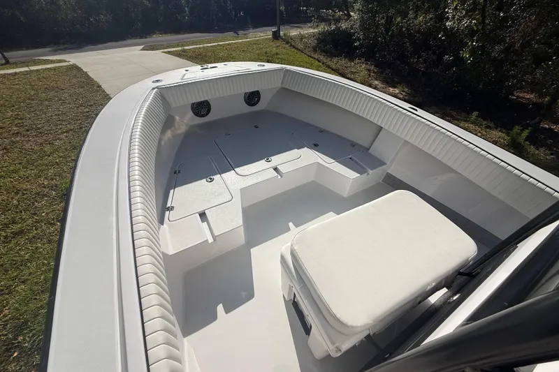 Slide: The Image of 1984 Chris-Craft 213 Scorpion boat interior with seating and storage compartments. - 32