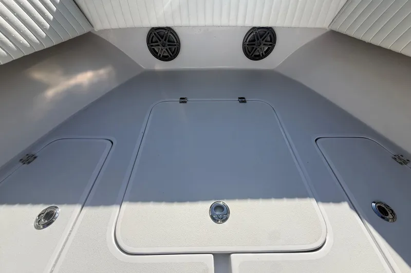 Slide: The Image of 1984 Chris-Craft 213 Scorpion boat interior with storage compartments and speakers. - 39