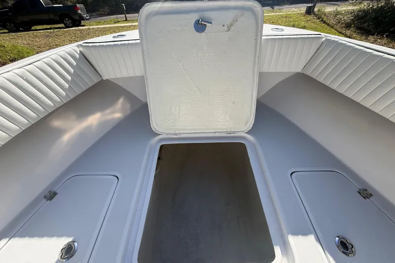 Slide: The Image of 1984 Chris-Craft 213 Scorpion boat interior with open storage compartments. - 40