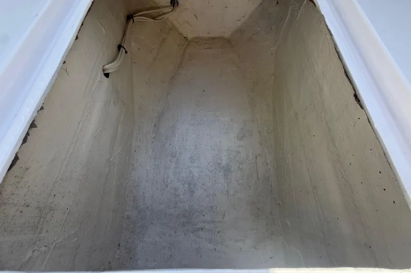 Slide: The Image of Storage compartment of a 1984 Chris-Craft 213 Scorpion boat, showing interior details. - 41