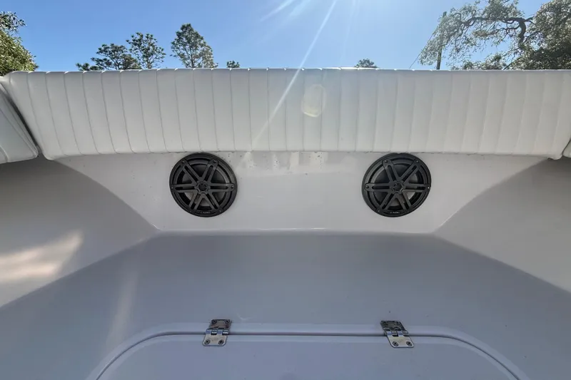 Slide: The Image of 1984 Chris-Craft 213 Scorpion boat interior with speakers and white upholstery. - 45