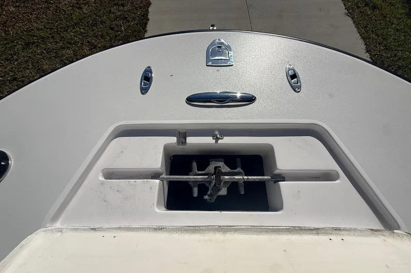 Slide: The Image of 1984 Chris-Craft 213 Scorpion boat bow with anchor storage and cleats. - 47