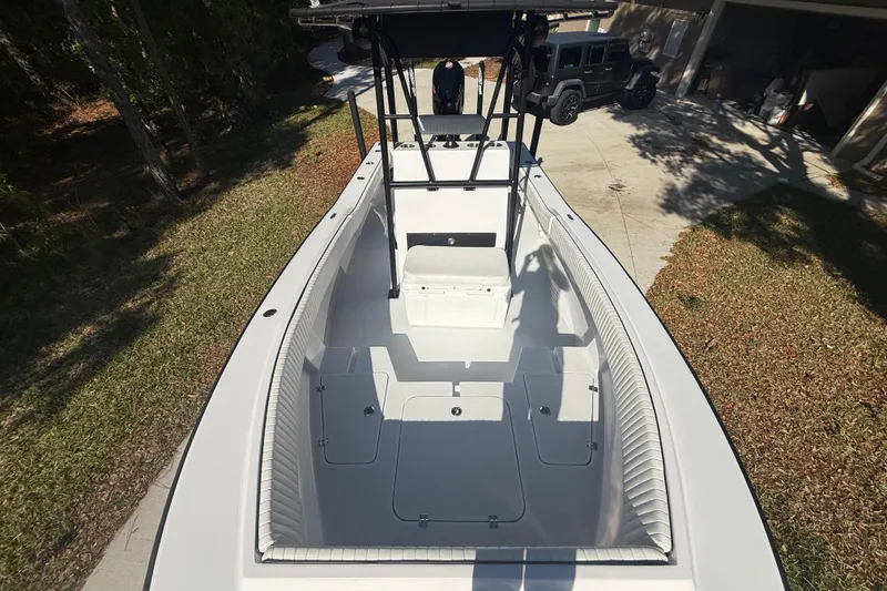 Slide: The Image of 1984 Chris-Craft 213 Scorpion boat, top view, parked on driveway. - 48