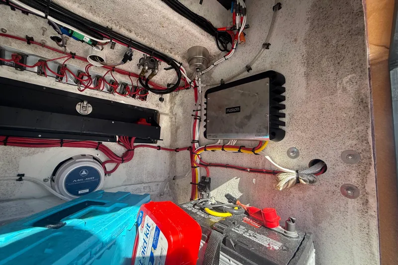 Slide: The Image of Electrical system inside a 1984 Chris-Craft 213 Scorpion boat, featuring wiring and components. - 53