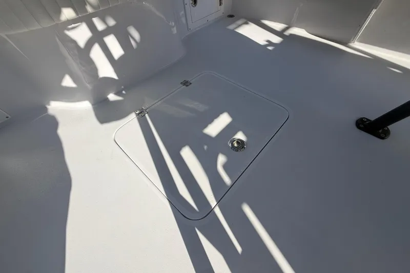 Slide: The Image of 1984 Chris-Craft 213 Scorpion boat deck with storage hatch and shadows. - 62