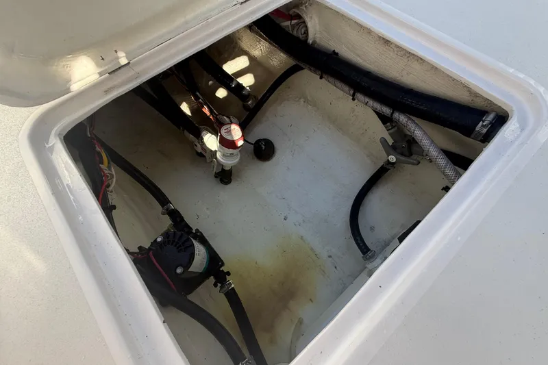 Slide: The Image of Open hatch of 1984 Chris-Craft 213 Scorpion showing internal components and wiring. - 63