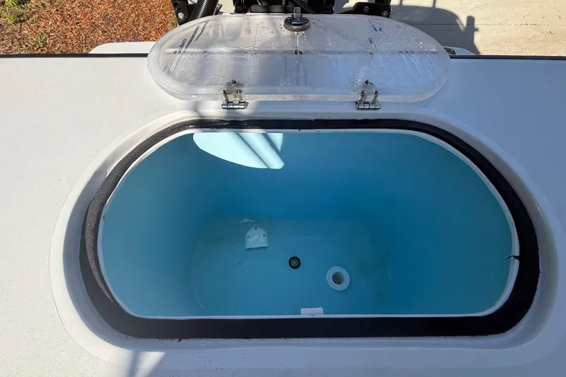 Slide: The Image of Livewell compartment on 1984 Chris-Craft 213 Scorpion boat, open lid, blue interior. - 68