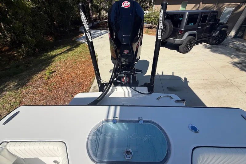 Slide: The Image of 1984 Chris-Craft 213 Scorpion boat with outboard motor and Power-Pole anchors. - 74