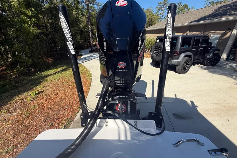 Slide: The Image of 1984 Chris-Craft 213 Scorpion boat with Power-Pole anchors in a driveway. - 75
