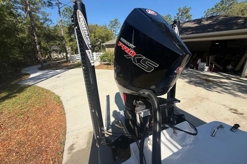 Slide: The Image of 1984 Chris-Craft 213 Scorpion with Mercury Pro XS engine in driveway setting. - 76