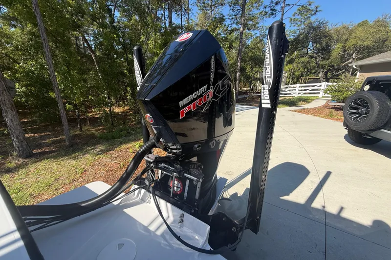 Slide: The Image of 1984 Chris-Craft 213 Scorpion with Mercury Pro XS engine in driveway setting. - 77