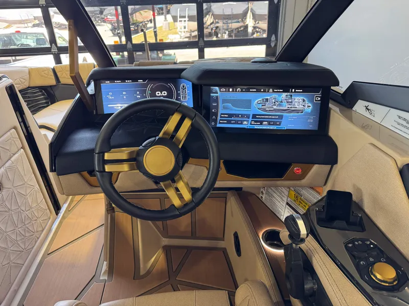 Slide: The Image of 2025 Nautique Super Air G23 Paragon cockpit with modern display and controls. - 29