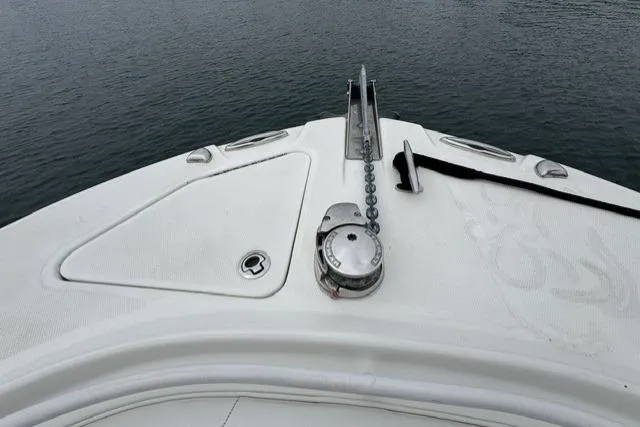 Slide: The Image of Bow of 2019 Edgewater 245CC boat with anchor chain and calm water background. - 14