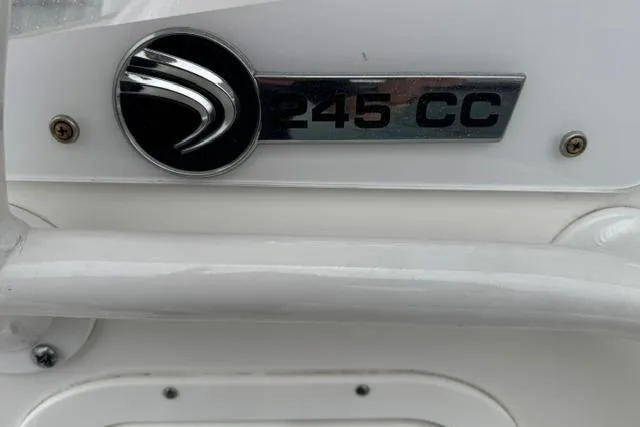 Slide: The Image of Edgewater 245CC 2019 boat emblem on a white surface. - 17