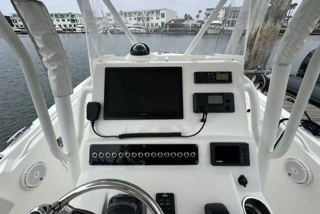 Slide: The Image of 2019 Edgewater 245CC boat dashboard with navigation and communication equipment. - 7