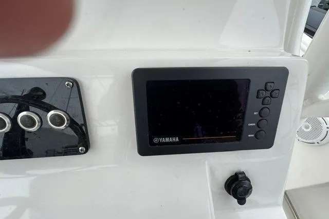 Slide: The Image of Control panel of a 2019 Edgewater 245CC boat featuring a Yamaha display. - 9