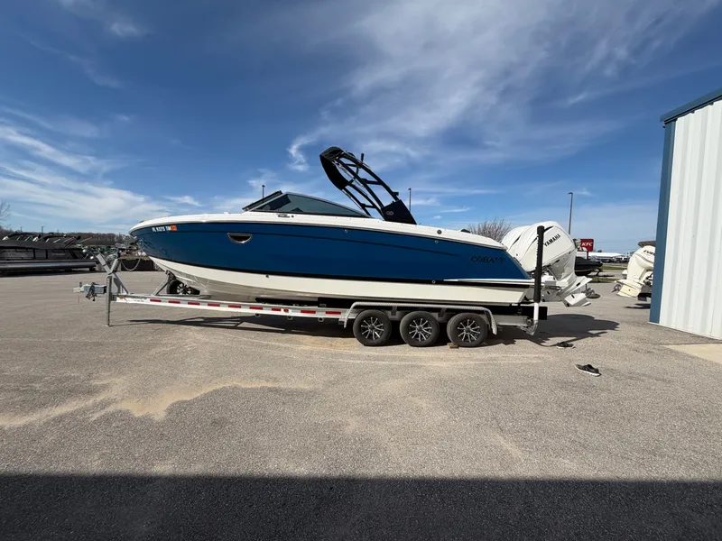The Image of 2023 Cobalt R8 Outboard boat on trailer outdoors. - 0